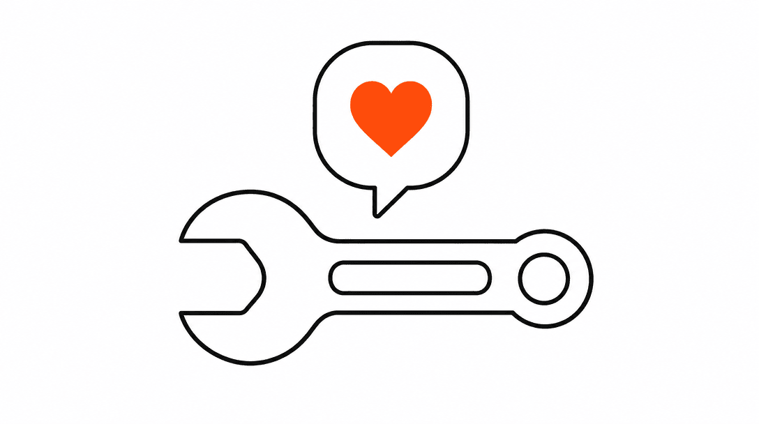 A wrench representing a completed service job with a speech bubble floating above it, the bubble outline in black filled with a small orange heart, on a white background