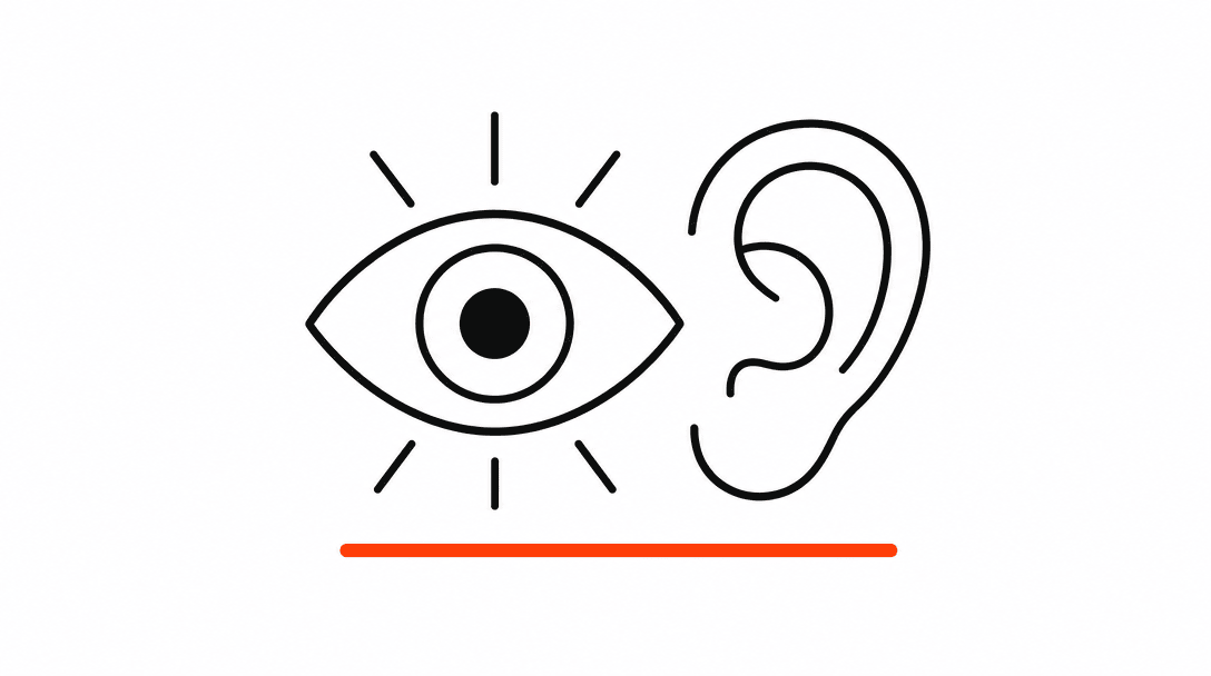 A flat Axiom-style illustration showing a simple eye icon and ear icon side by side inside a white rectangle, with a single orange underline beneath them, representing visual and hearing accessibility