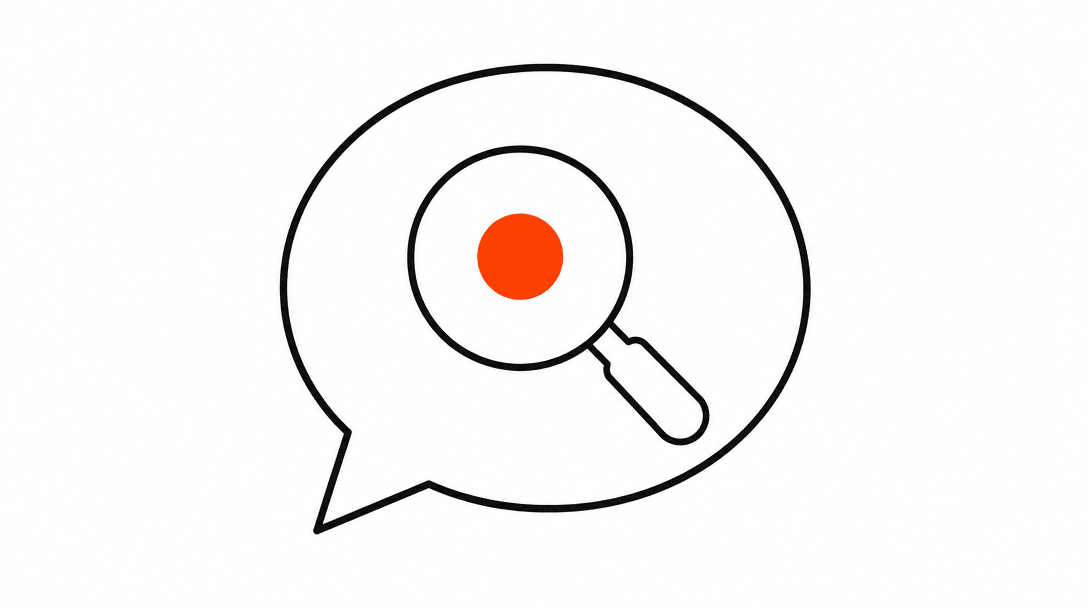 Speech bubble outline with a small magnifying glass inside, one orange dot at the center of the lens, on a white background.